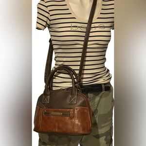 Stone Mountain USA, two tone crossbody bag. W / A 49” adj. shoulder strap.